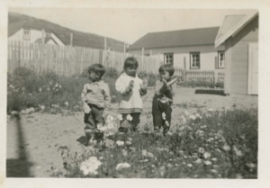 Image of Children outside MacMillan's School, showing off new mittens